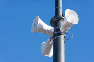 Loudspeaker on a pole in the city, the public alert system.